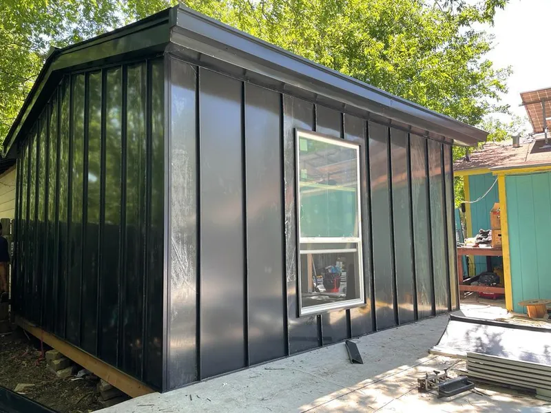 Black standing seam metal wall panels for Roof Inspection in Thomas